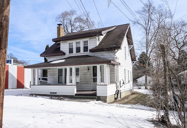 bungalow-style house with a porch and a chimney