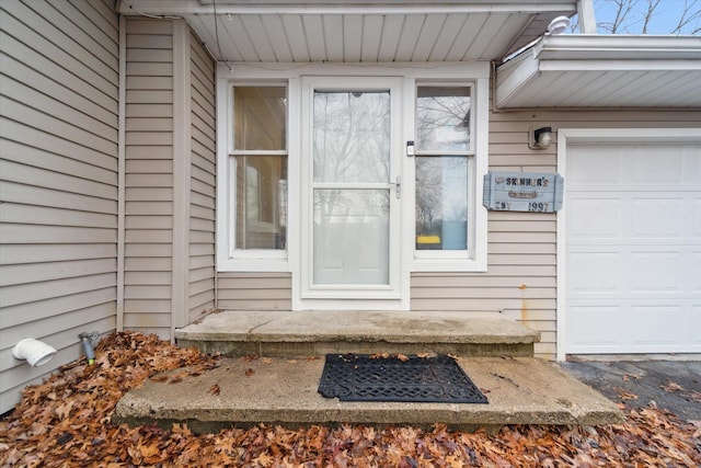 entrance to property featuring a garage