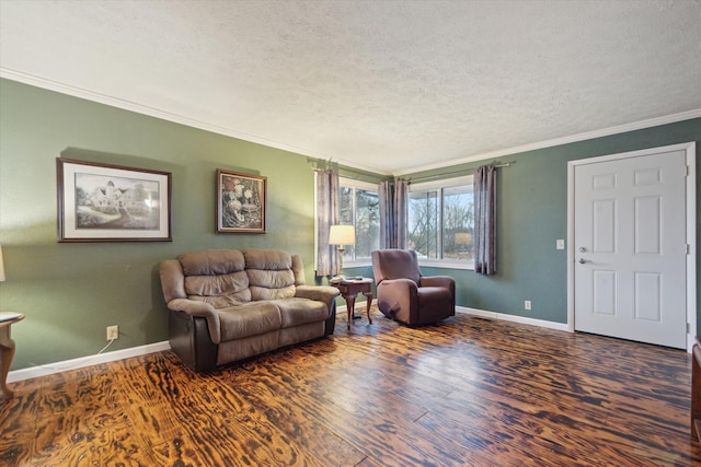 living area featuring baseboards, wood finished floors, and crown molding