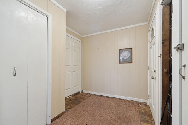 unfurnished bedroom with baseboards, a closet, and crown molding