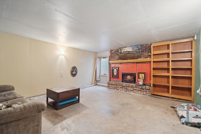 living area featuring concrete flooring, a brick fireplace, and baseboard heating