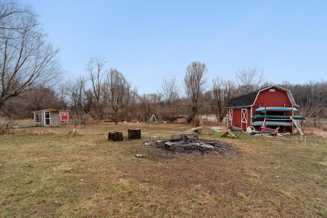 view of yard featuring a barn and an outdoor structure