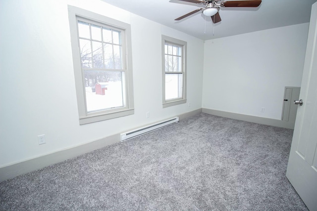 unfurnished room with a baseboard radiator, baseboards, ceiling fan, and carpet flooring