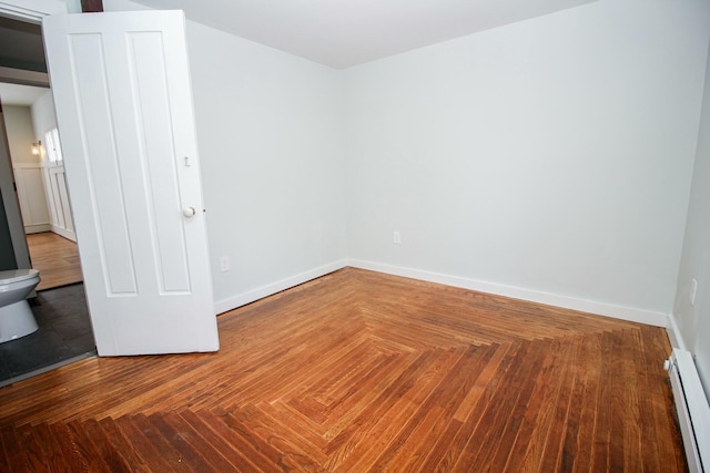 empty room with baseboards and baseboard heating