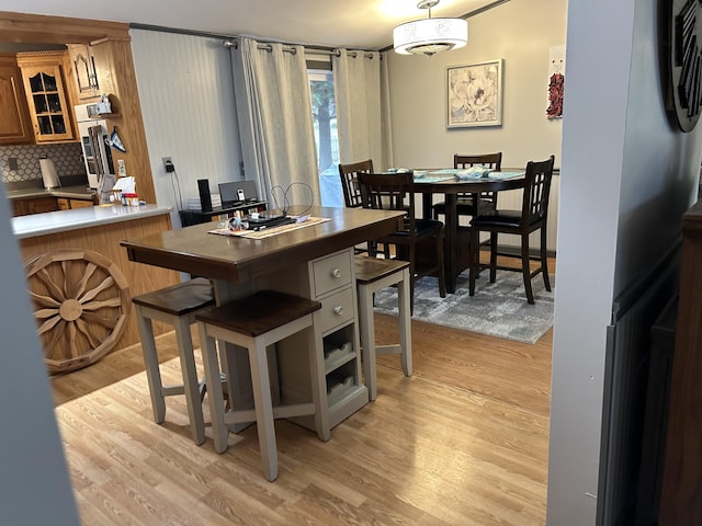 dining area with light wood-style flooring