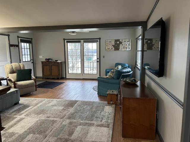 interior space featuring wood finished floors and crown molding