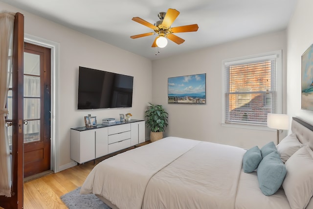 bedroom with light wood-type flooring and ceiling fan