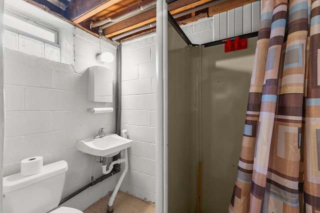 bathroom featuring toilet and a sink