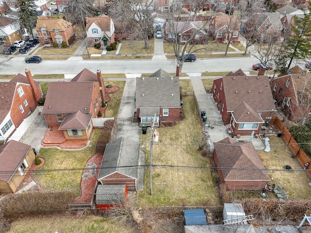 birds eye view of property with a residential view