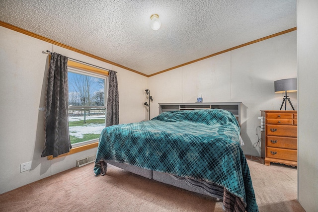 bedroom with carpet floors, visible vents, crown molding, and a textured ceiling