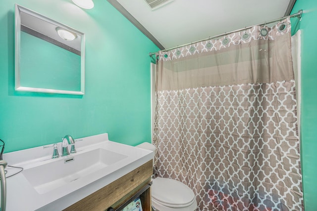 full bath with a shower with curtain, visible vents, vanity, and toilet