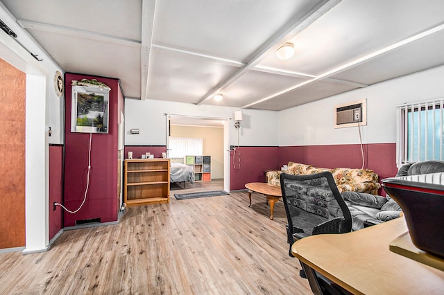 interior space featuring a wall mounted AC and light wood-style floors