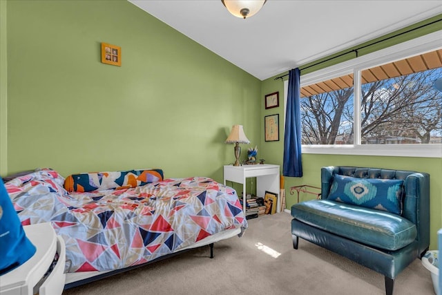 carpeted bedroom featuring vaulted ceiling