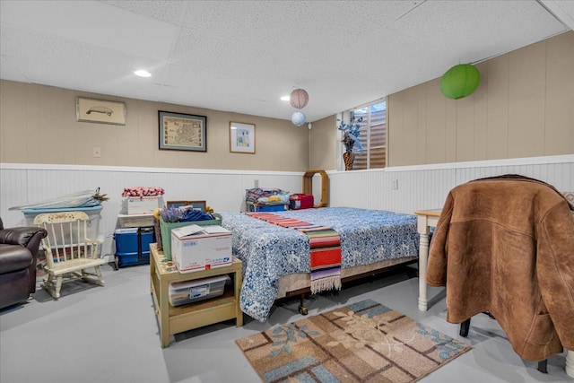 bedroom featuring concrete floors