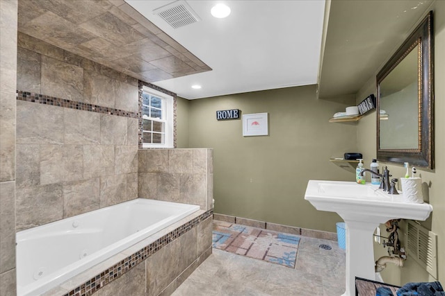 bathroom with visible vents, recessed lighting, a jetted tub, and baseboards