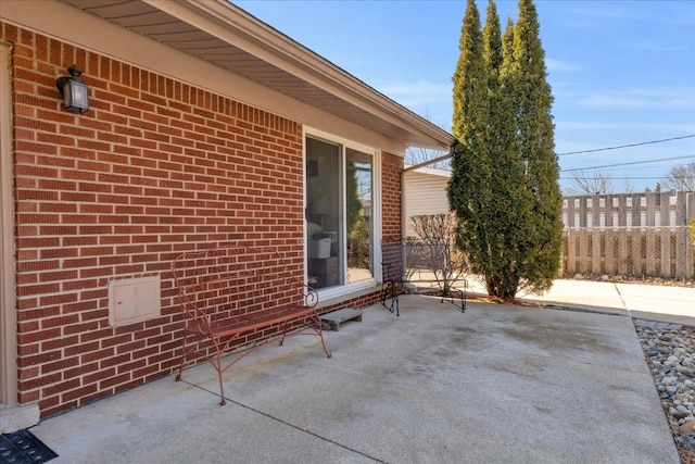 view of patio featuring fence