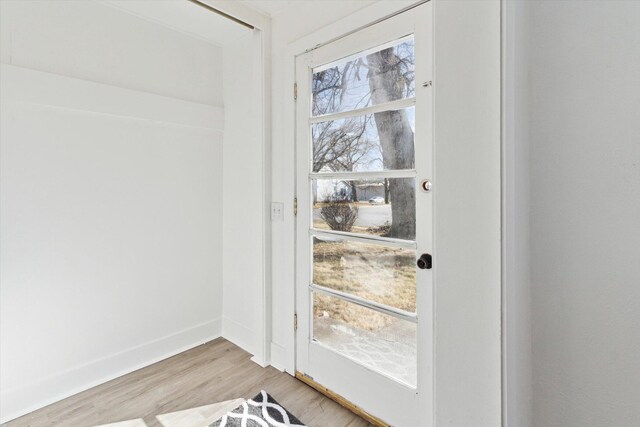 225 E Home St, Edmore, MI 48829 - details with baseboards and wood finished floors