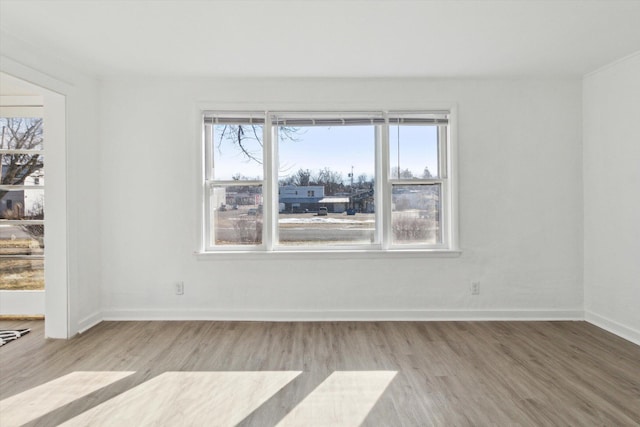 225 E Home St, Edmore, MI 48829 - unfurnished room with wood finished floors and baseboards