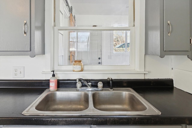 225 E Home St, Edmore, MI 48829 - kitchen view of a sink and dark countertops