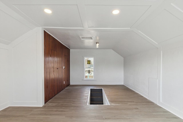 225 E Home St, Edmore, MI 48829 - additional living space featuring lofted ceiling, wood finished floors, and baseboards