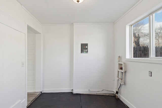 225 E Home St, Edmore, MI 48829 - spare room with ornamental molding, baseboards, and finished concrete floors