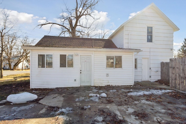 225 E Home St, Edmore, MI 48829 - back of house featuring a shingled roof