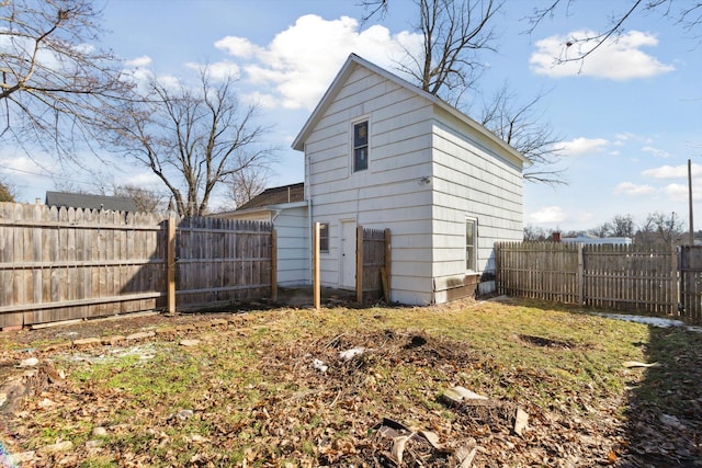 225 E Home St, Edmore, MI 48829 - back of house featuring a fenced backyard
