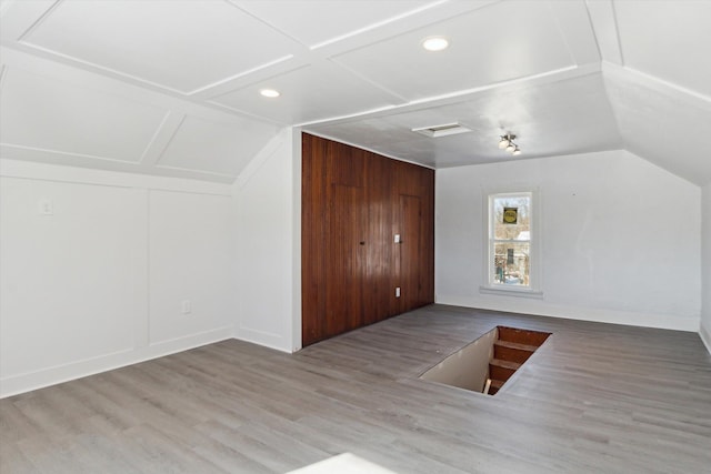 225 E Home St, Edmore, MI 48829 - bonus room featuring vaulted ceiling, wood finished floors, recessed lighting, and baseboards