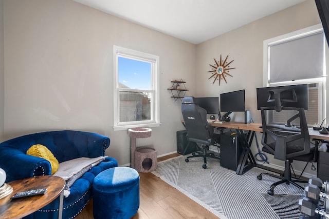 office area featuring baseboards and wood finished floors