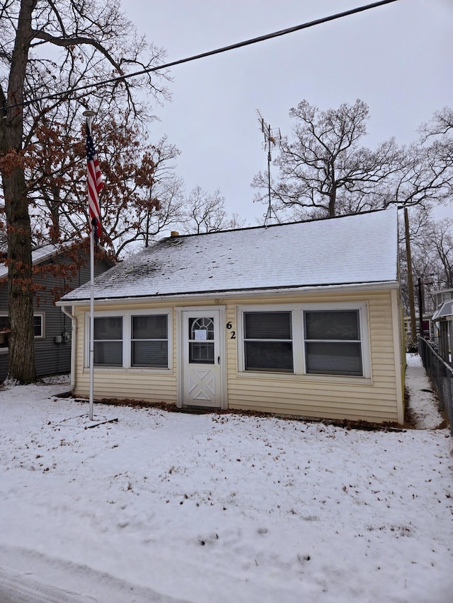 view of front of home featuring fence