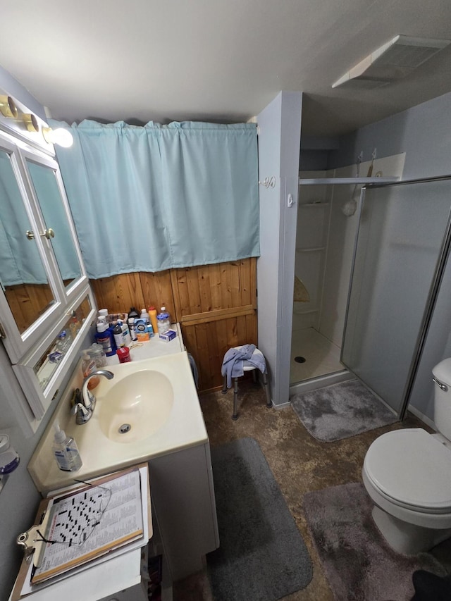 bathroom featuring toilet, a stall shower, unfinished concrete floors, and vanity