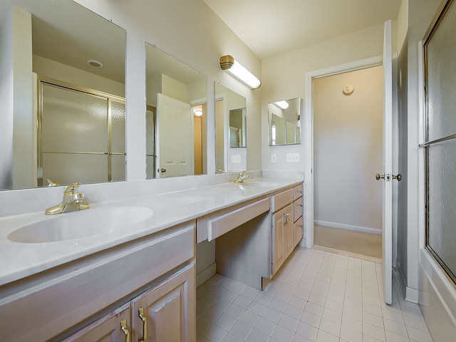 full bathroom featuring double vanity, tile patterned flooring, a sink, and a shower with shower door