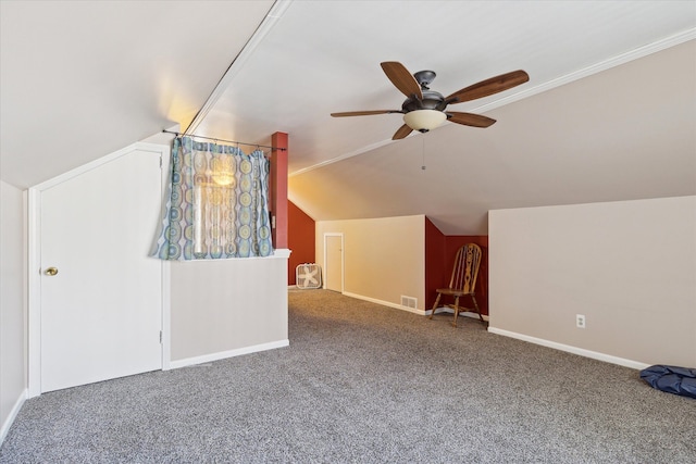 additional living space with lofted ceiling, carpet, visible vents, and baseboards