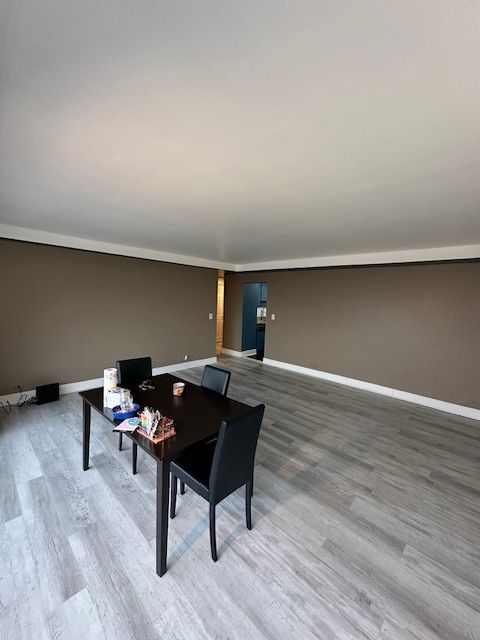 office area featuring baseboards and wood finished floors