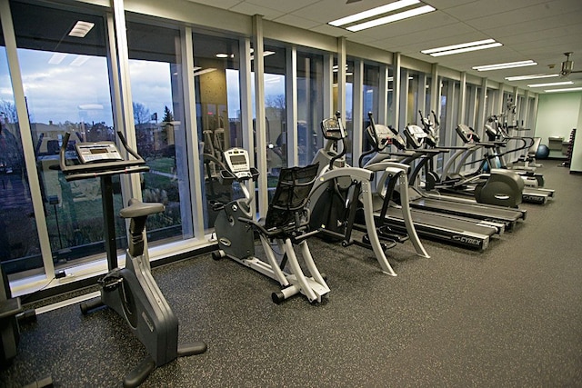 gym featuring a paneled ceiling