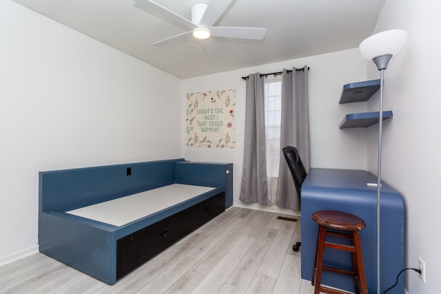 office featuring visible vents, wood finished floors, and a ceiling fan