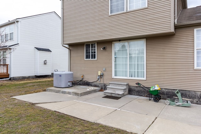 back of property featuring entry steps