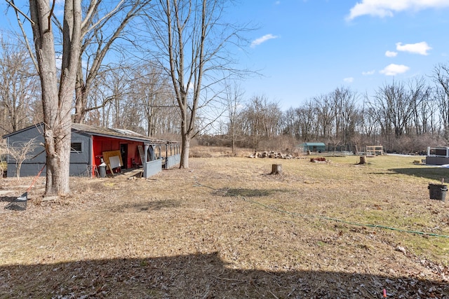 view of yard with an outbuilding and a pole building