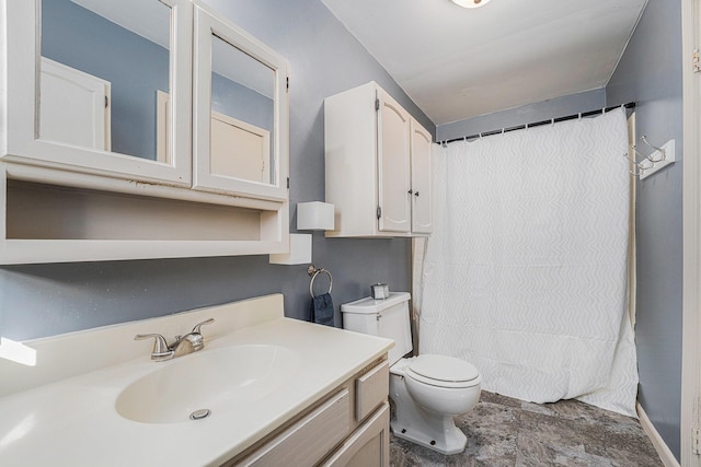 bathroom featuring vanity, toilet, and a shower with curtain