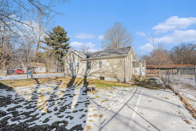 rear view of house with fence