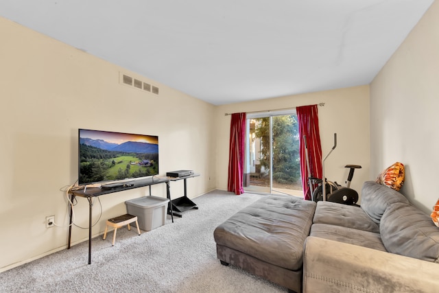 living room with carpet floors, visible vents, and baseboards