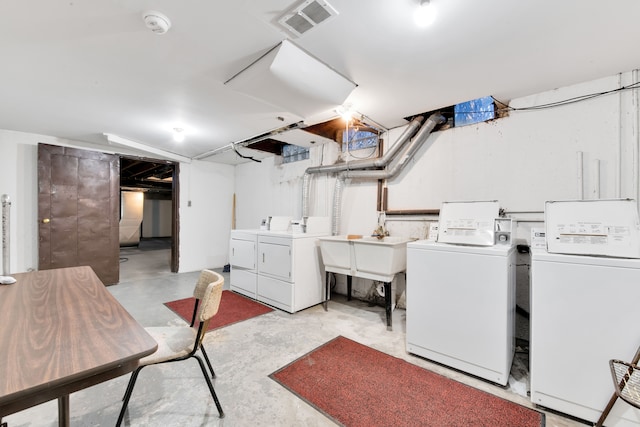 shared laundry area with independent washer and dryer and visible vents