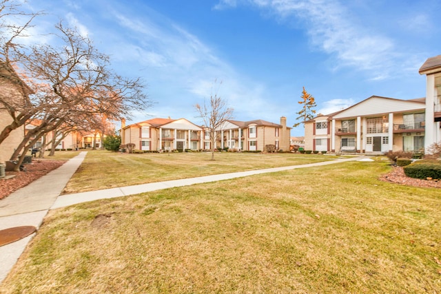 view of community with a residential view and a lawn