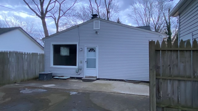 back of house featuring a fenced backyard and a patio