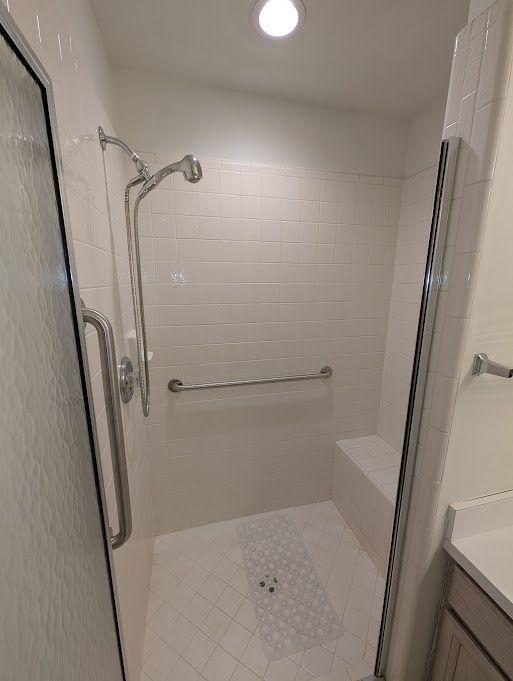 full bath featuring a shower stall and vanity