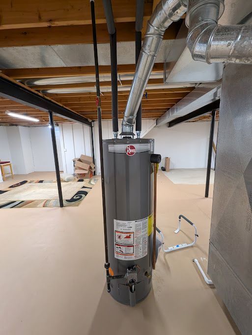 unfinished basement with gas water heater