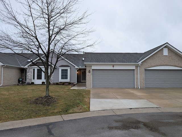 view of front of home featuring a garage, concrete driveway, brick siding, and a front lawn