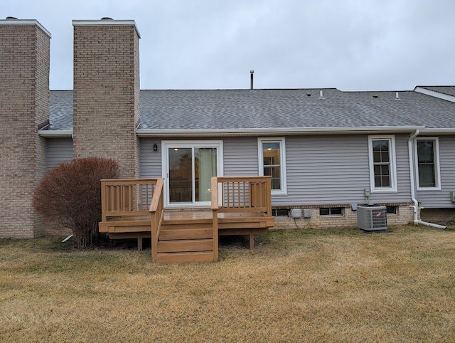 rear view of house with a shingled roof, a lawn, crawl space, a deck, and cooling unit