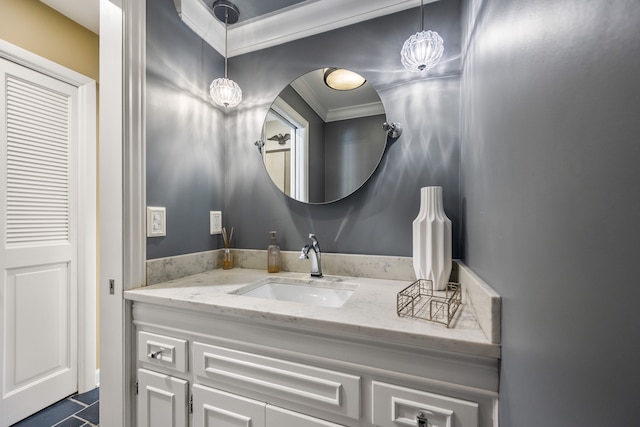 bathroom featuring crown molding and vanity