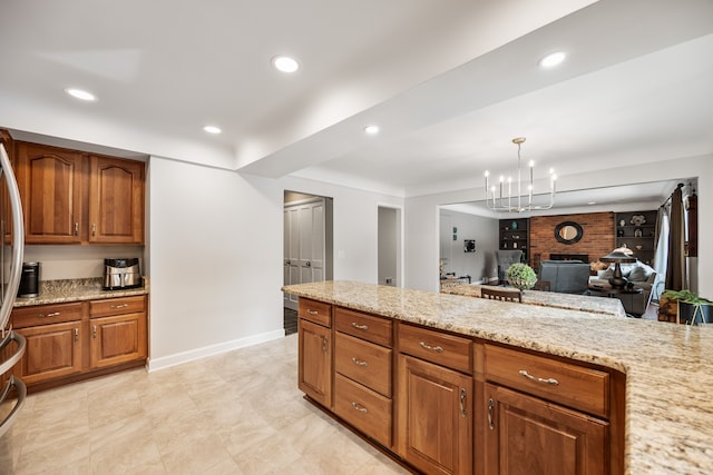 kitchen featuring light stone counters and recessed lighting